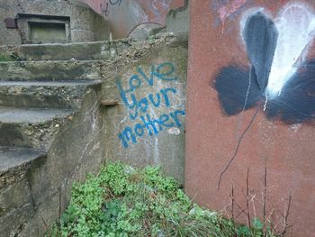 Reflection of man on multi colored umbrella