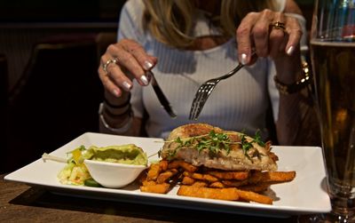 Midsection of woman at restaurant