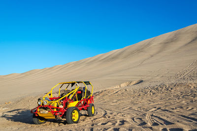 View of desert against blue sky