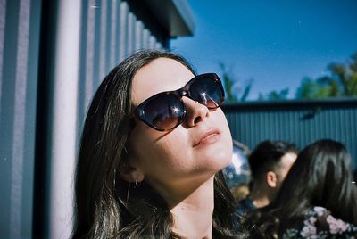 Portrait of a young woman wearing sunglasses