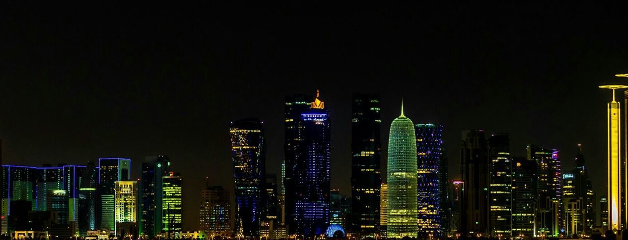 illuminated, night, building exterior, architecture, built structure, skyscraper, city, tall - high, modern, tower, office building, cityscape, urban skyline, financial district, tall, building, clear sky, sky, copy space, development