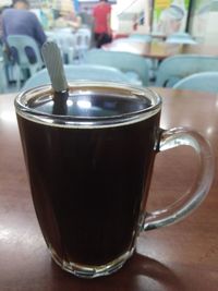 Close-up of coffee cup on table