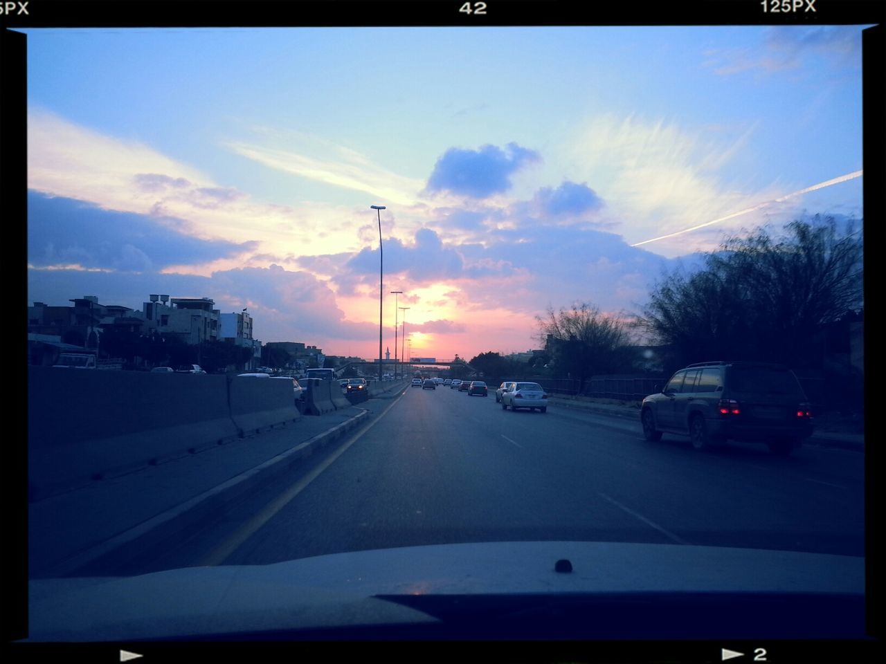 transportation, car, land vehicle, mode of transport, road, sunset, sky, street, road marking, the way forward, traffic, on the move, transfer print, tree, cloud - sky, travel, diminishing perspective, auto post production filter, street light, cloud