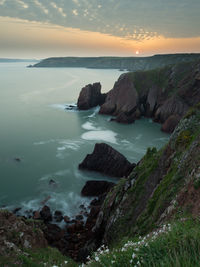 Scenic view of sea against sky during sunset