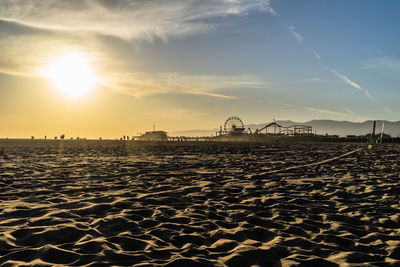 View of beach against sky during sunset