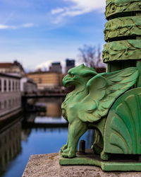 Statue of historic building against sky