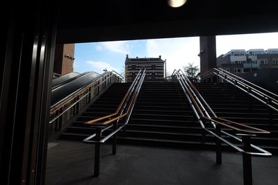 Low angle view of staircase in building against sky