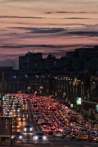 High angle view of traffic on city street during sunset