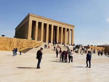 Group of people in front of historical building