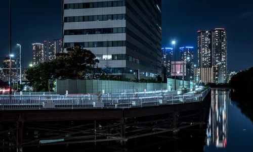 Illuminated buildings in city at night