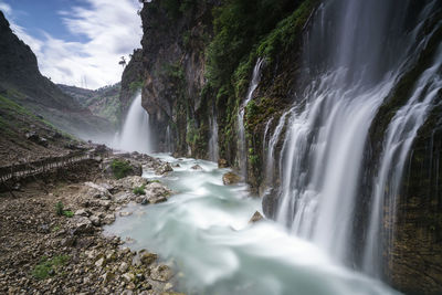 Scenic view of waterfall in forest