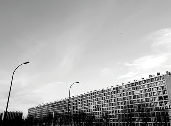 Low angle view of building against cloudy sky