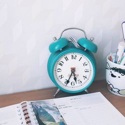 Close-up of clock on table