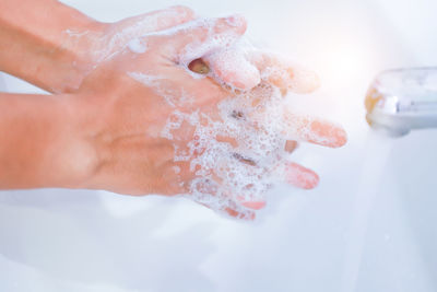 Close-up of hand holding ice cream