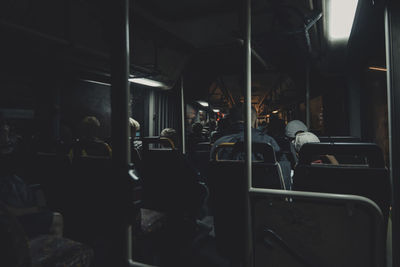 Rear view of people traveling in bus