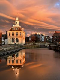 Cityscape against sky during sunset