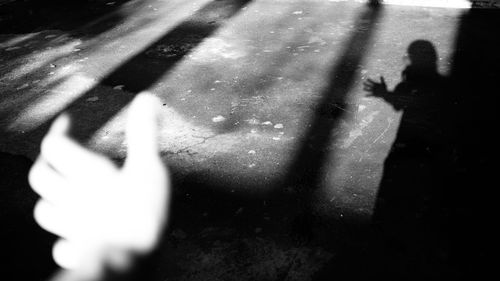 Shadow of people on street in city