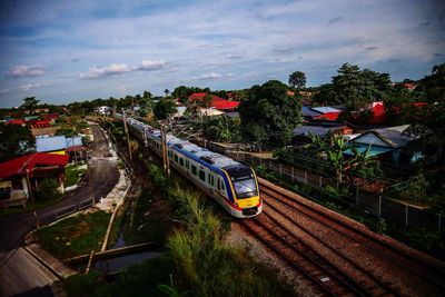 High angle view of train amidst trees against sky