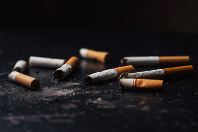 Close-up of cigarette smoking on table