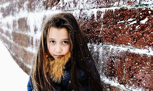 Close-up portrait of girl in snow