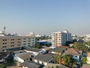 High angle view of buildings against clear sky