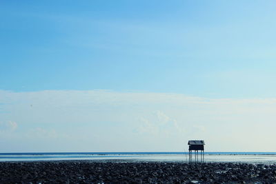 Scenic view of sea against blue sky