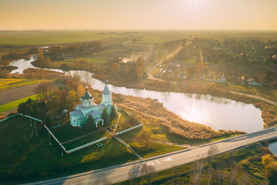 High angle view of river amidst land against sky