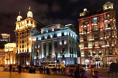 Illuminated buildings in city at night