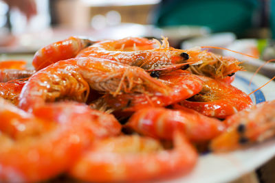 Close-up of red chili peppers in plate on table