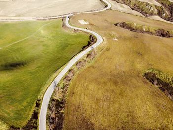 High angle view of road amidst green landscape