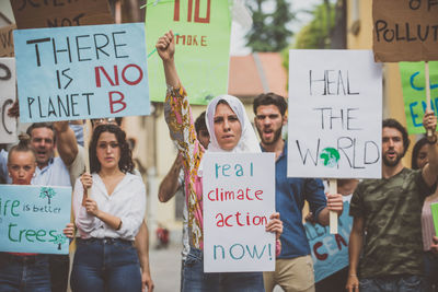 People with banners protesting in city