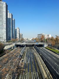 High angle view of railroad tracks against clear blue sky