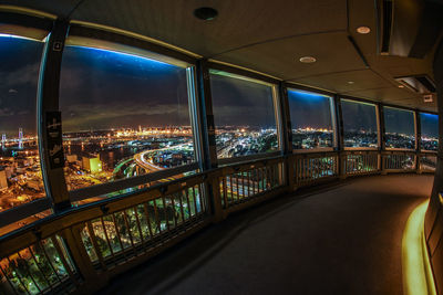 Illuminated bridge in city at night