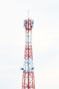 Low angle view of communications tower against sky