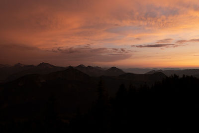 Scenic view of silhouette mountains against sky during sunset