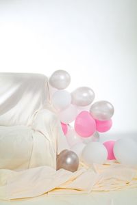 White balloons on bed at home