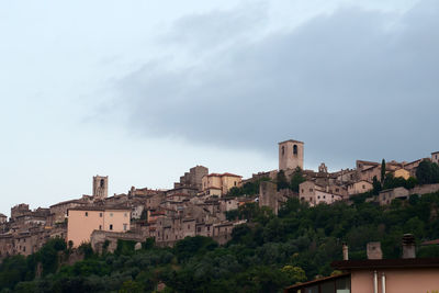 Buildings in city against sky