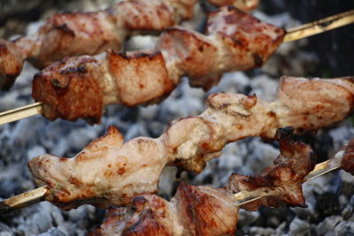 Close-up of meat on barbecue grill