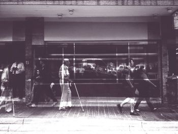 People walking on railroad station platform