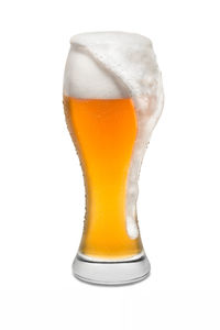 Close-up of beer glass against white background