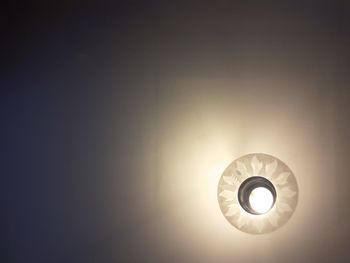 Low angle view of illuminated light bulb