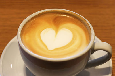 Close-up of cappuccino on table