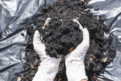 Hands holding abundance soil for agriculture or preparing to plant testing soil samples on hands 