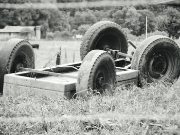 Close-up of abandoned truck on field