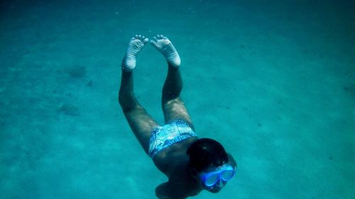 High angle view of man swimming in sea