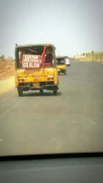 Vintage car on road against sky