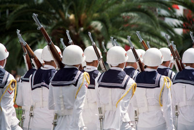 Rear view of soldiers walking outdoors