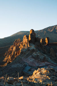 Scenic view of rocky mountains against clear sky