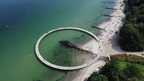 High angle view of wheel by sea