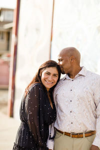 Happy couple standing outdoors